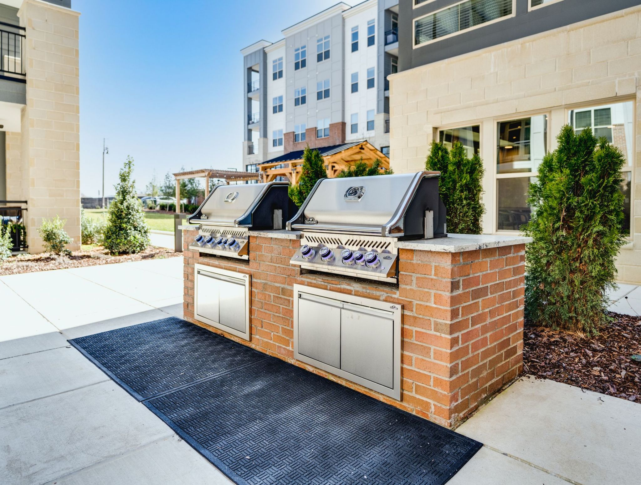 Two outdoor gas grills at McEwen Northside Apartments