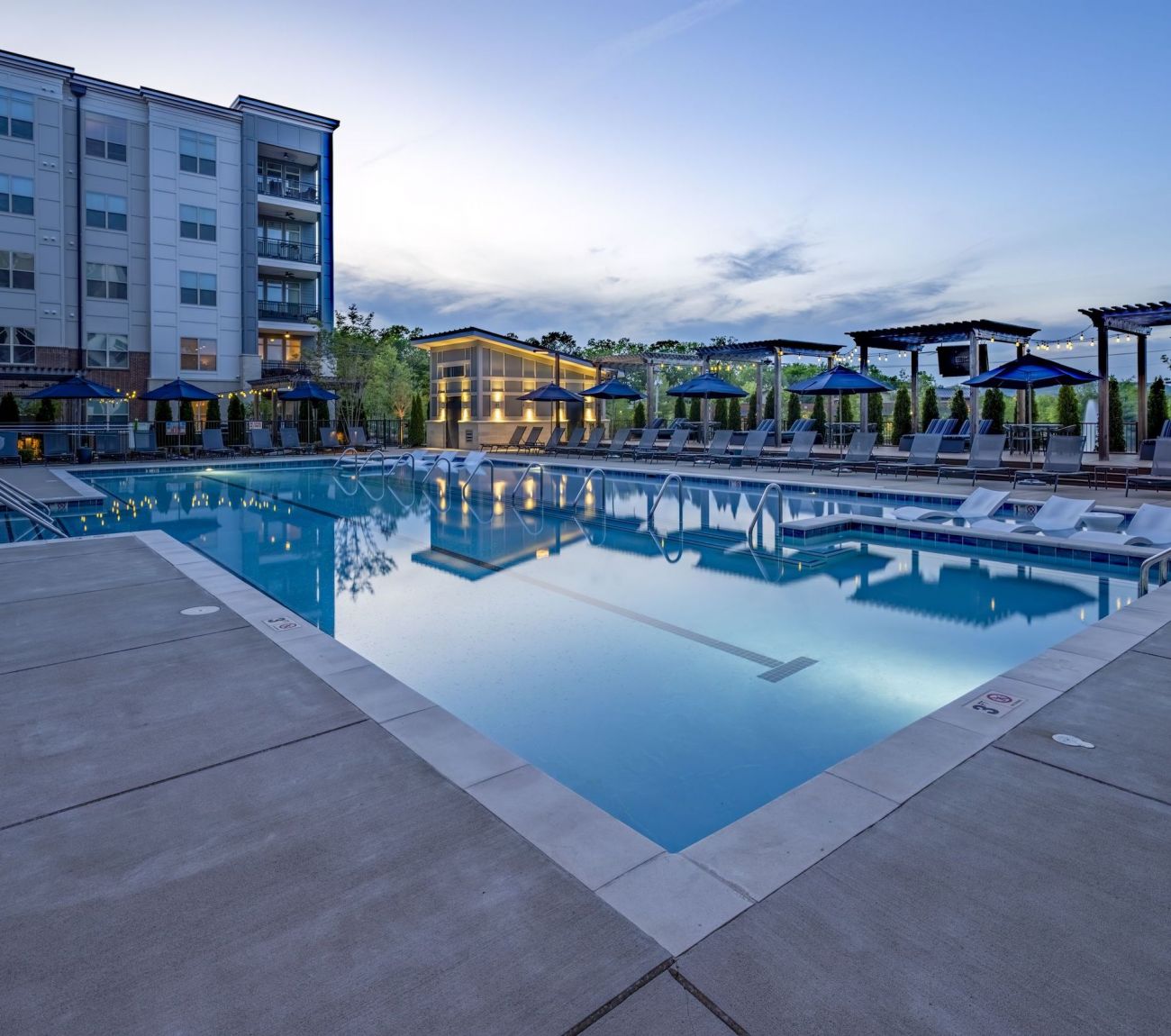 Resort-inspired pool with poolside cabanas at McEwen Northside Apartments