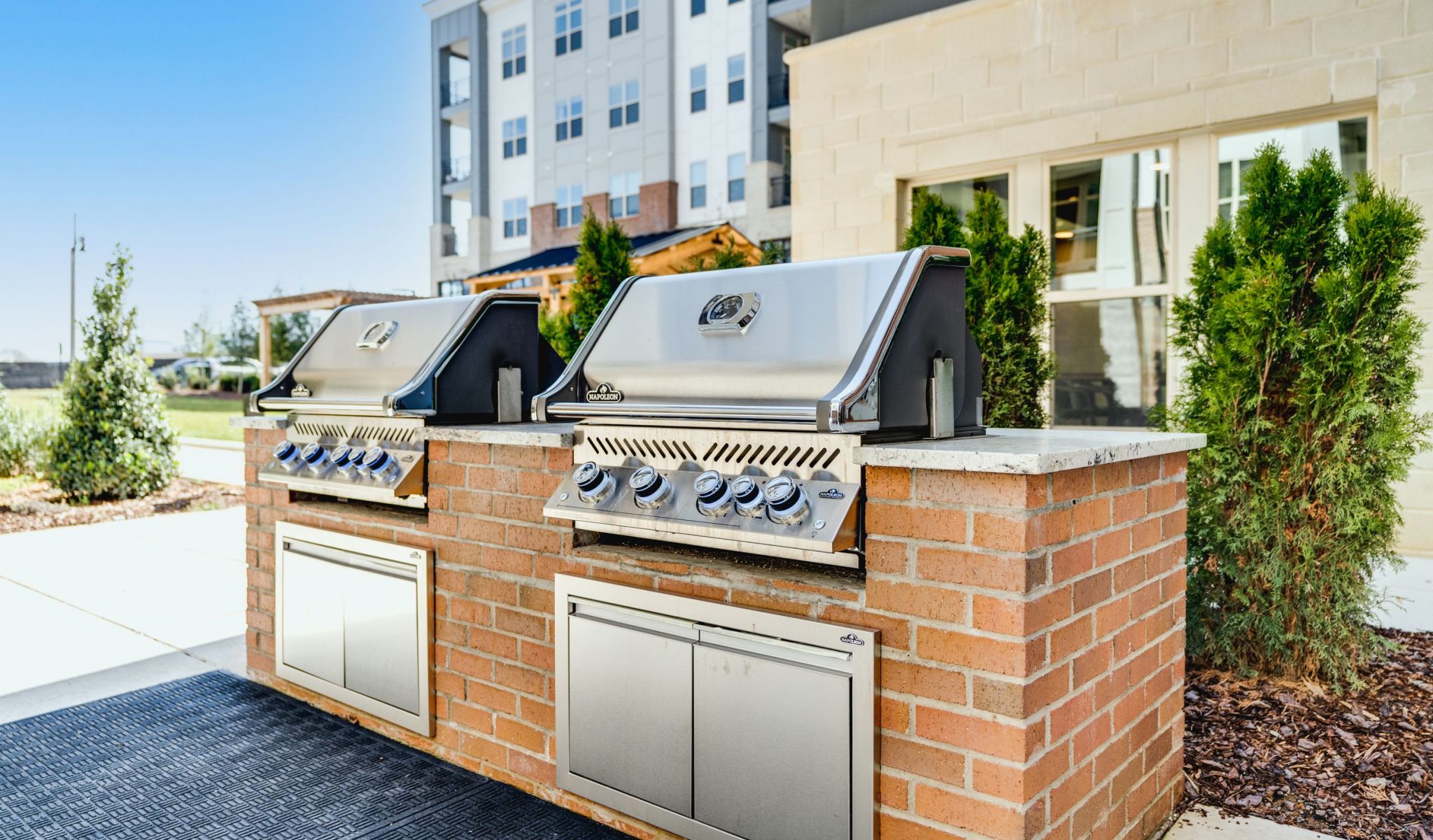 Two outdoor gas grills at McEwen Northside Apartments