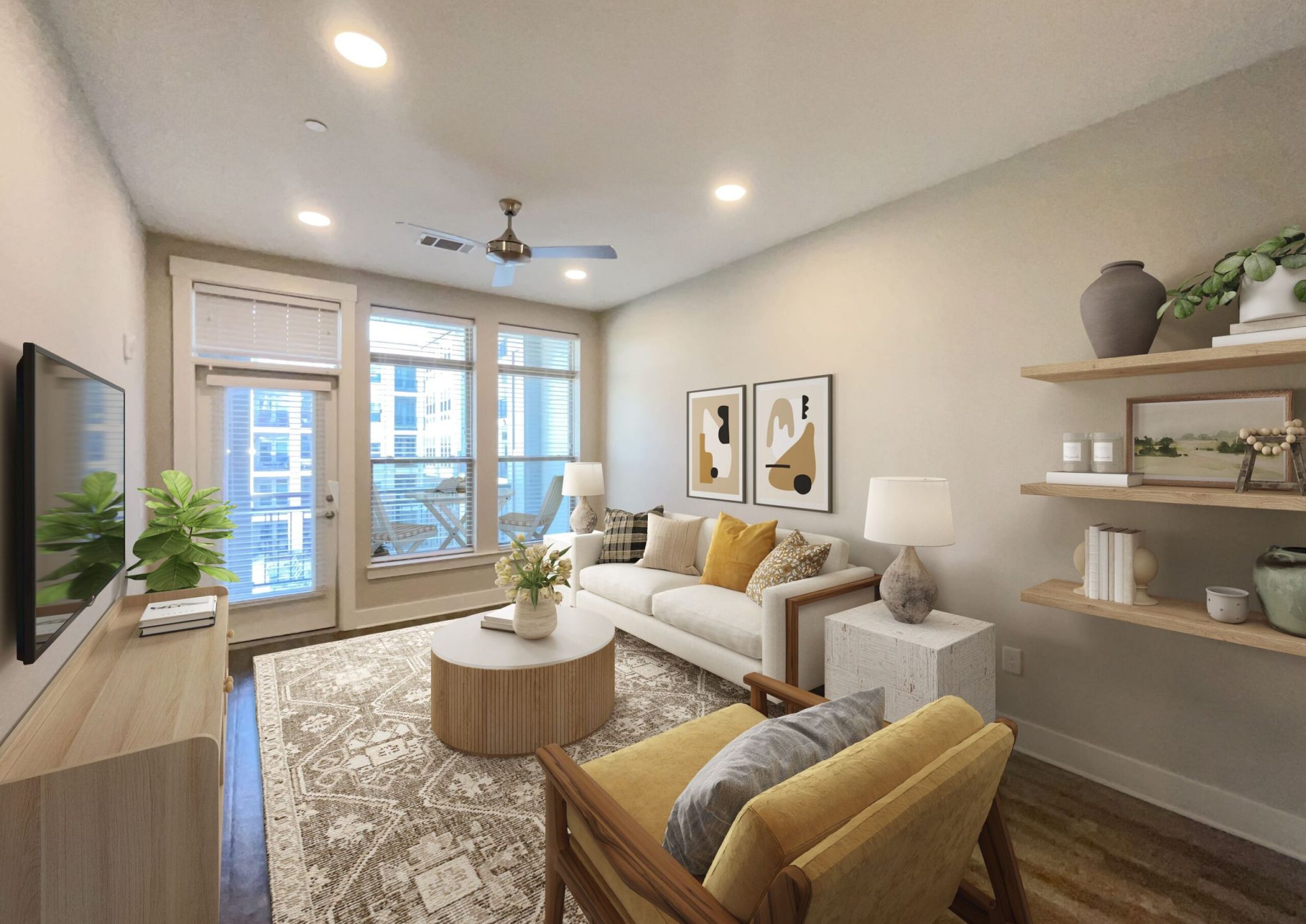 Furnished living area with sofa, chair, and large window at McEwen Northside Apartments