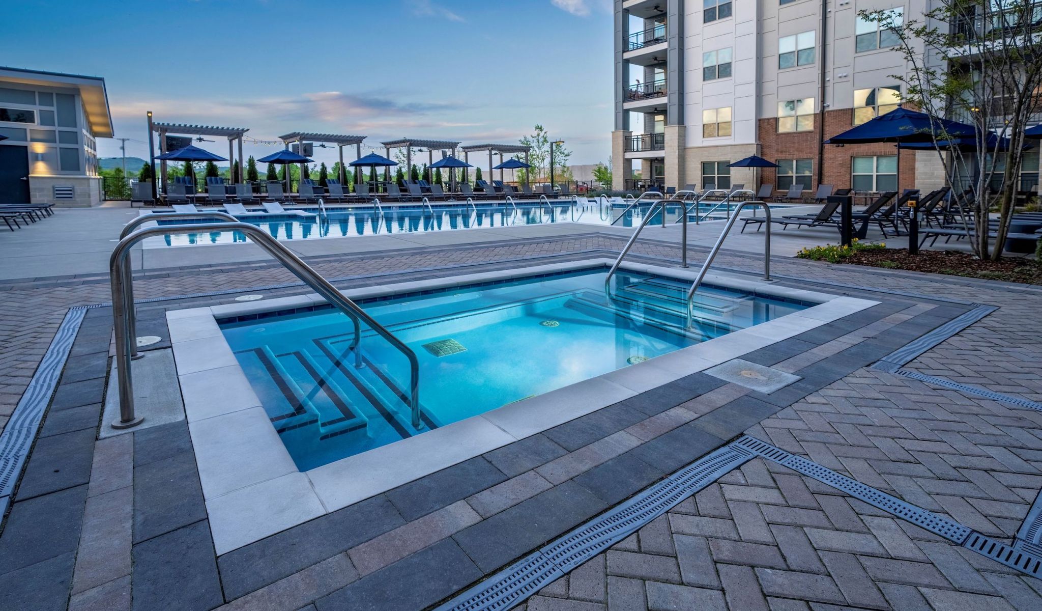 Outdoor jacuzzi at night time located at McEwen Apartments