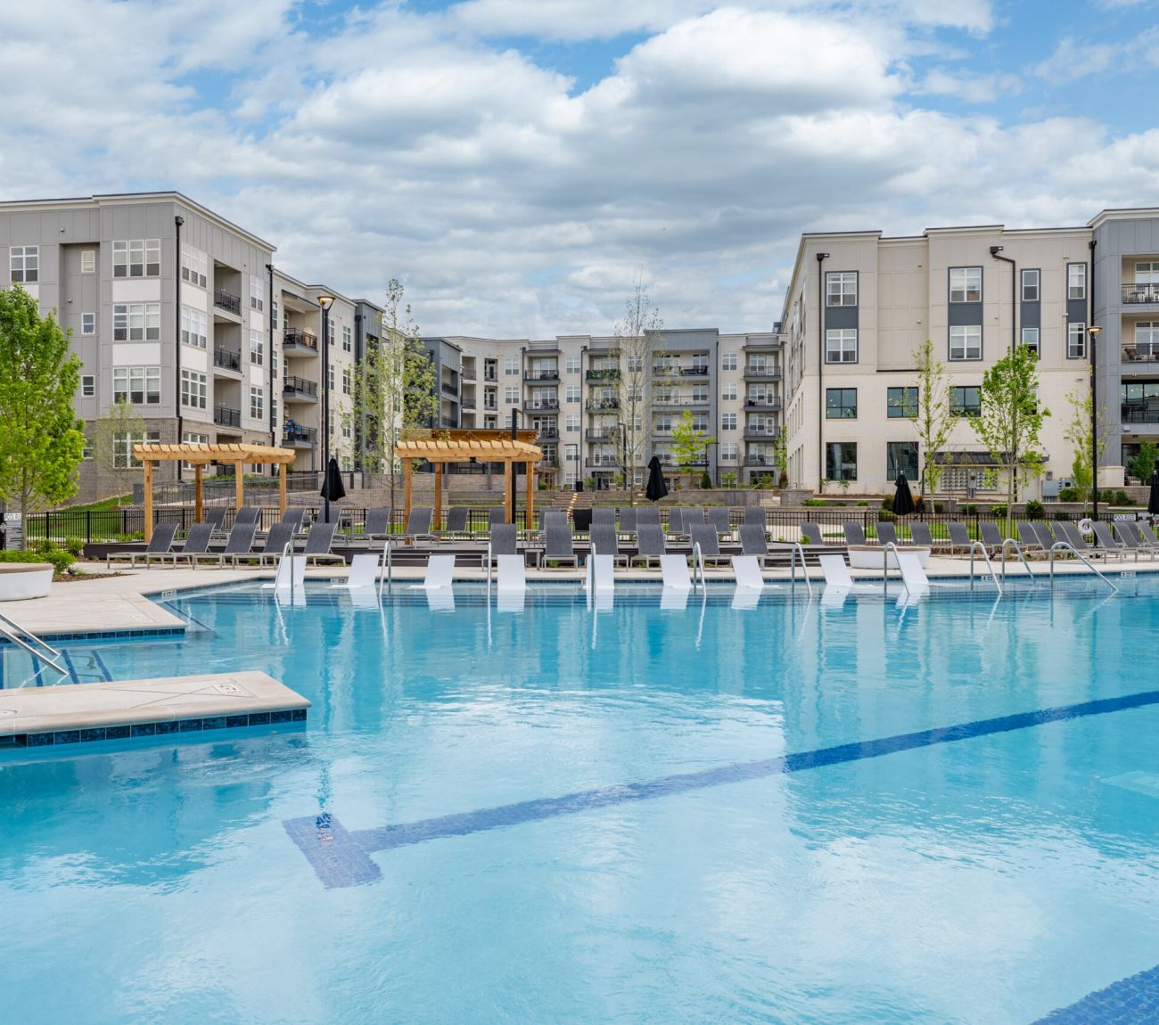 Resort-inspired pool with poolside cabanas at McEwen Northside Apartments